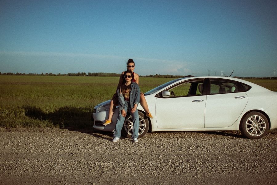 Travelers with their rental car in the Riviera Maya